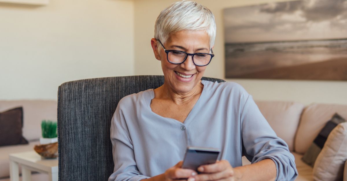 Senior woman looking at her smartphone